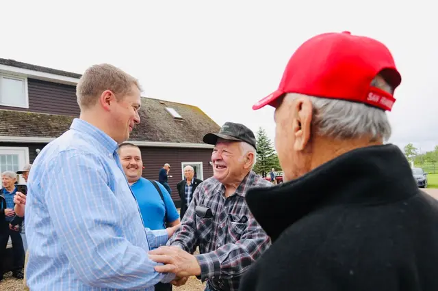 Neighbours greeting each other at a gathering in Debden